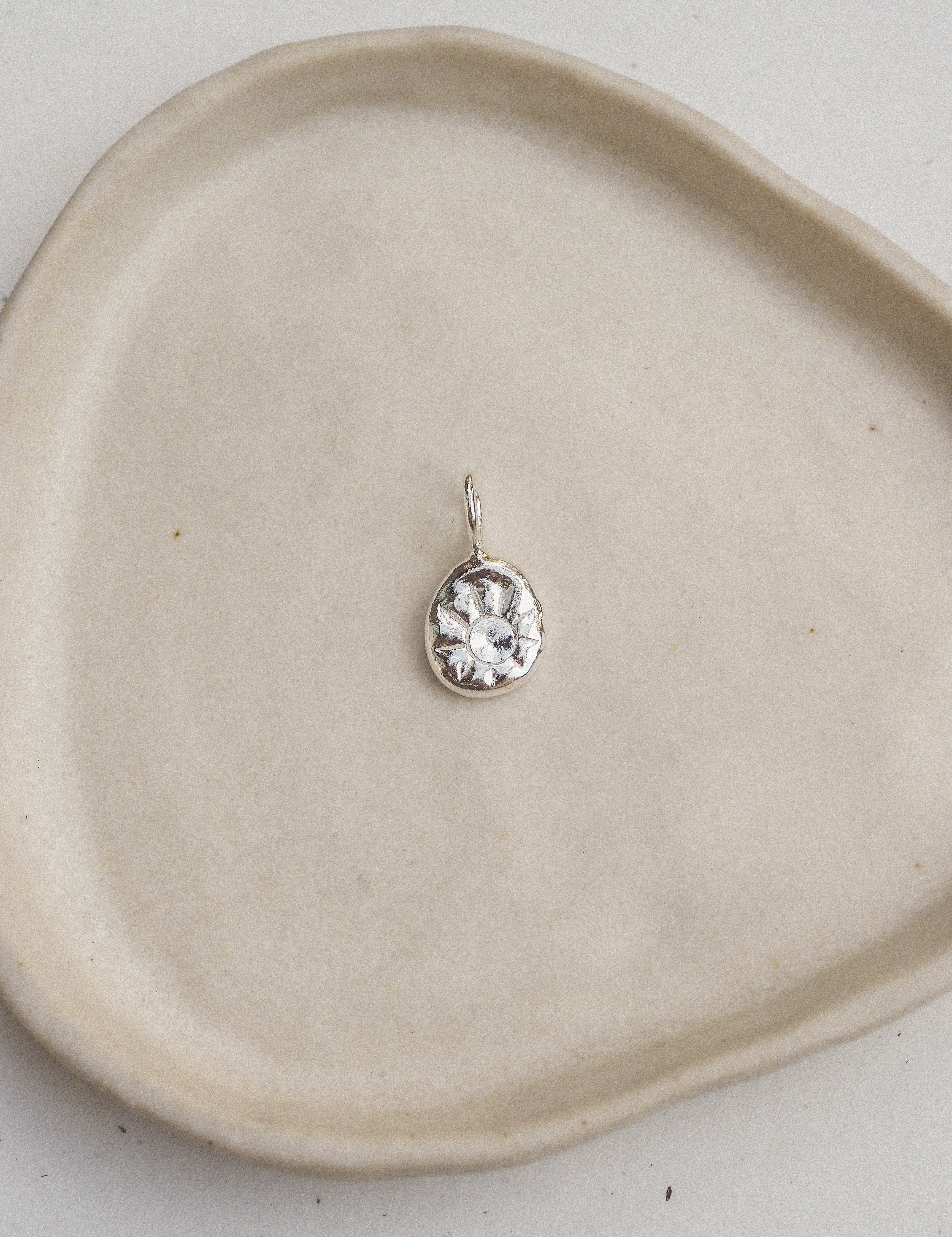 silver sun charm